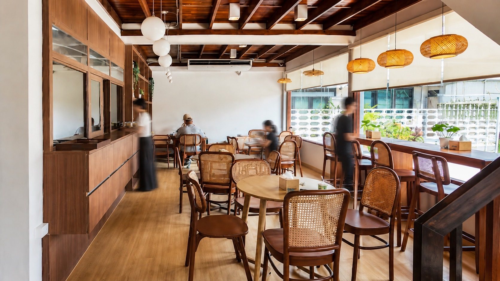 interior seating area Baan Maria cafe กรุงเทพ warm material design — inhaus